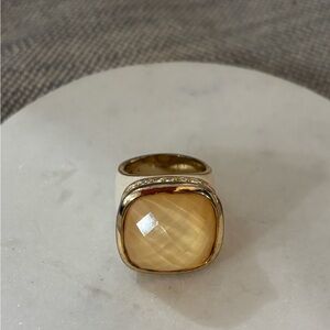 Elegant Gold and Cream Ring with Yellow Gemstone